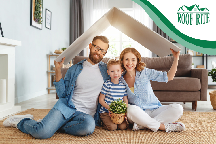 A happy family enjoying a warm, cozy living room thanks to insulated siding.