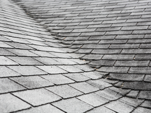 Aging roof in need of inspection by a roofing contractor in Lewes, showcasing typical wear over time."