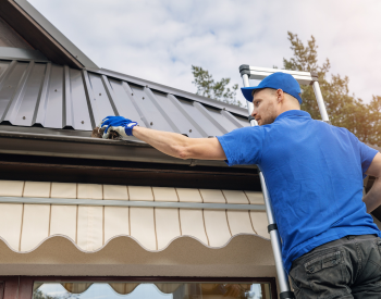 Cleaning gutters on an Ocean View home
