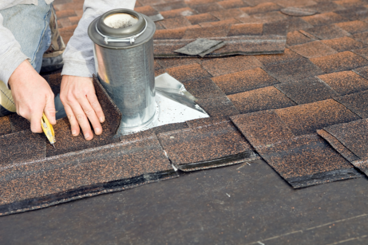 professional roofer repairs damaged flashing and shingles in Lewes, DE