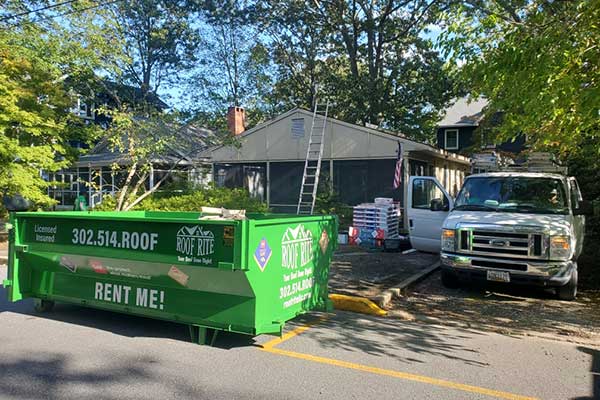 Green Roof Rite dumpster in front of a home being worked on