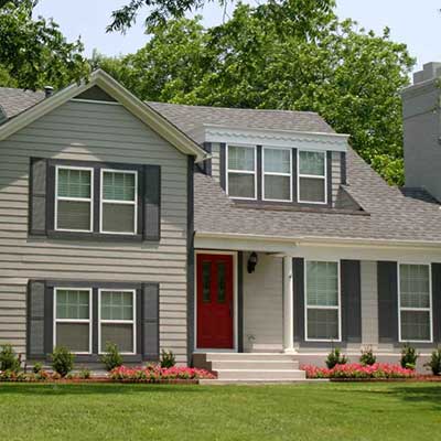 Mid-class, two-story home with a light gray shingle roof