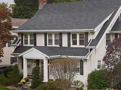 Two-story Wilmington DE home with dark gray architectural shingles installed by Roof Rite