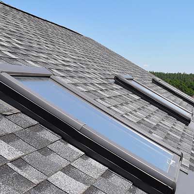Skylights on a residential roof seen from the outside